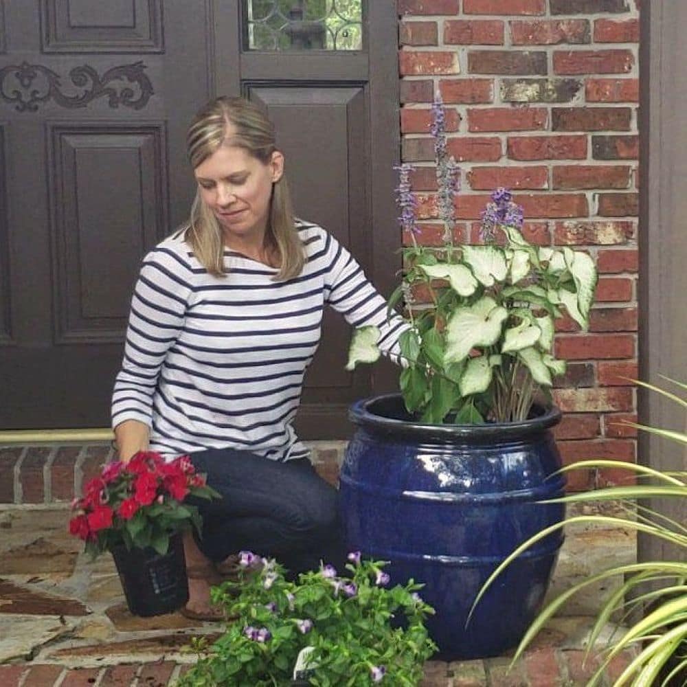 Woman Planting in a Pot on a Front Porch