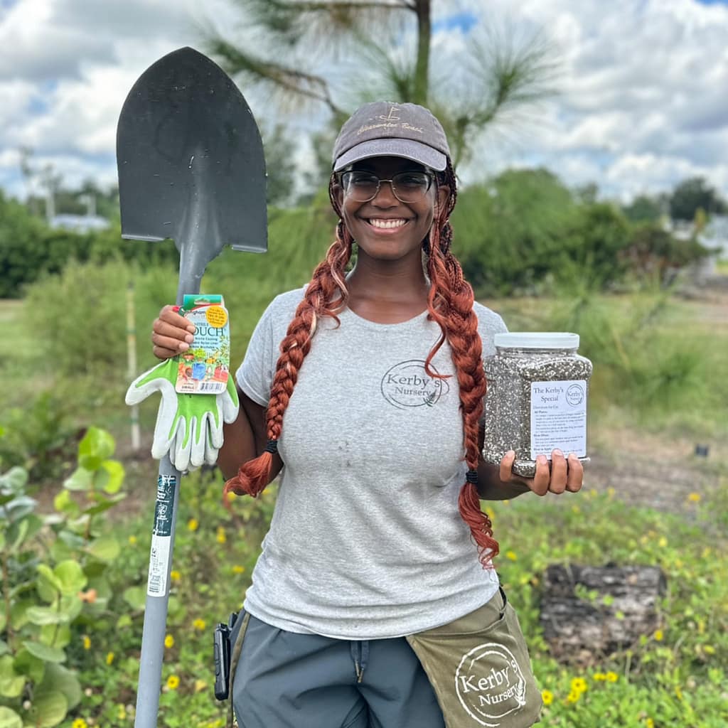Kerby's Nursery Staff Person (Lady) with A Shovel, Gloves, and Jar of Fertilizer