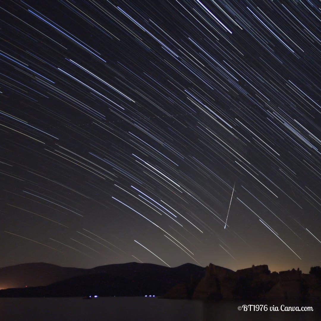 Perseid Meteor Shower in Night Sky Over Mountains