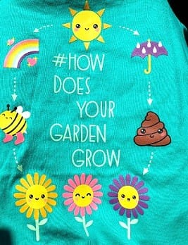 T-shirt That Says "How Does Your Garden Grow" with Graphics of Flowers, Sun, Bee, Rainbow, Umbrella, and Poop Emoji