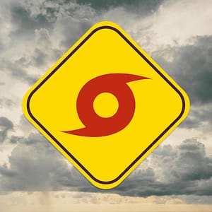 Hurricane Warning Sign Over Cloudy Sky