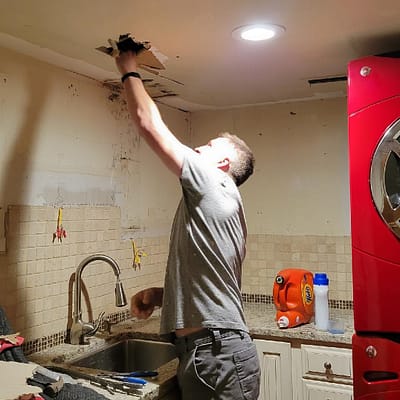 Joey looking in the ceiling for his dive light.