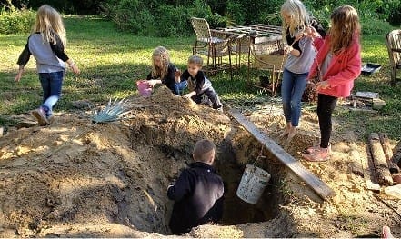 Kids Digging an Underground Clubhouse