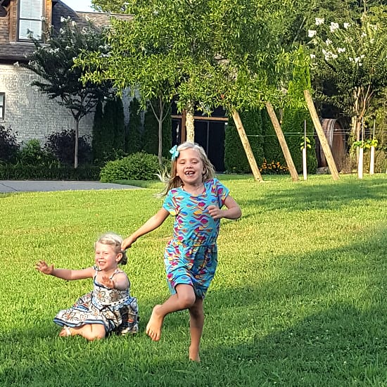 Maddy and Abby Running in the Grass - Easter