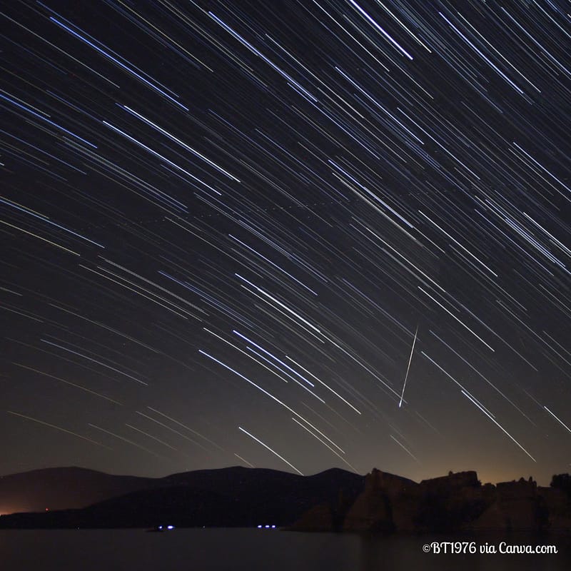 Perseid Meteor Shower in Night Sky Over Mountains