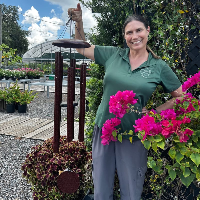 Kerby's Staff Person Holding Windchime and Bougainvillea
