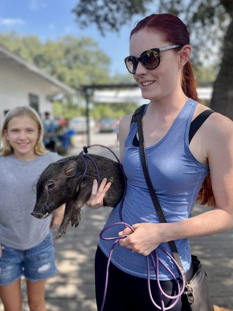 Lady with Pig at Kerby's Nursery Plants & Pets Event