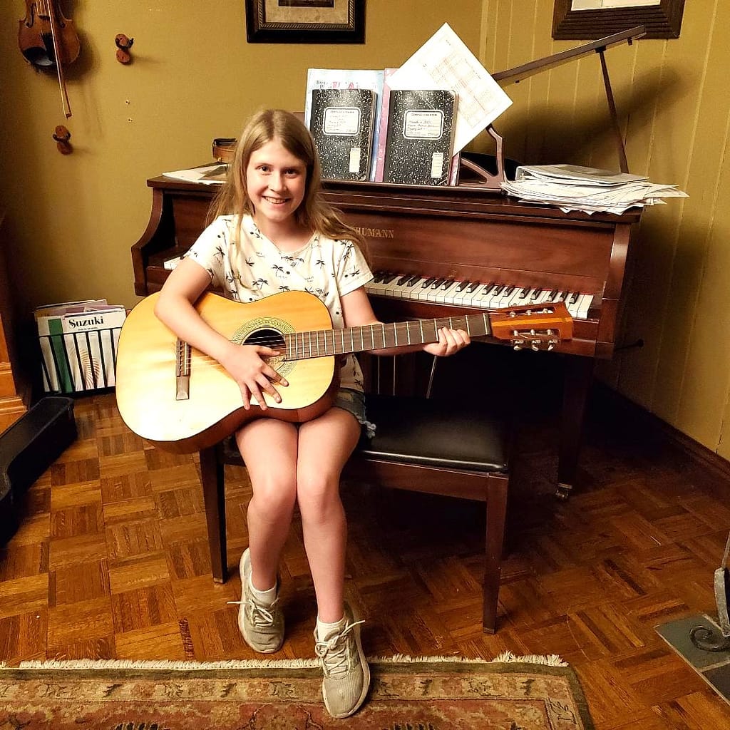 Maddie with Her Grandfather's Guitar