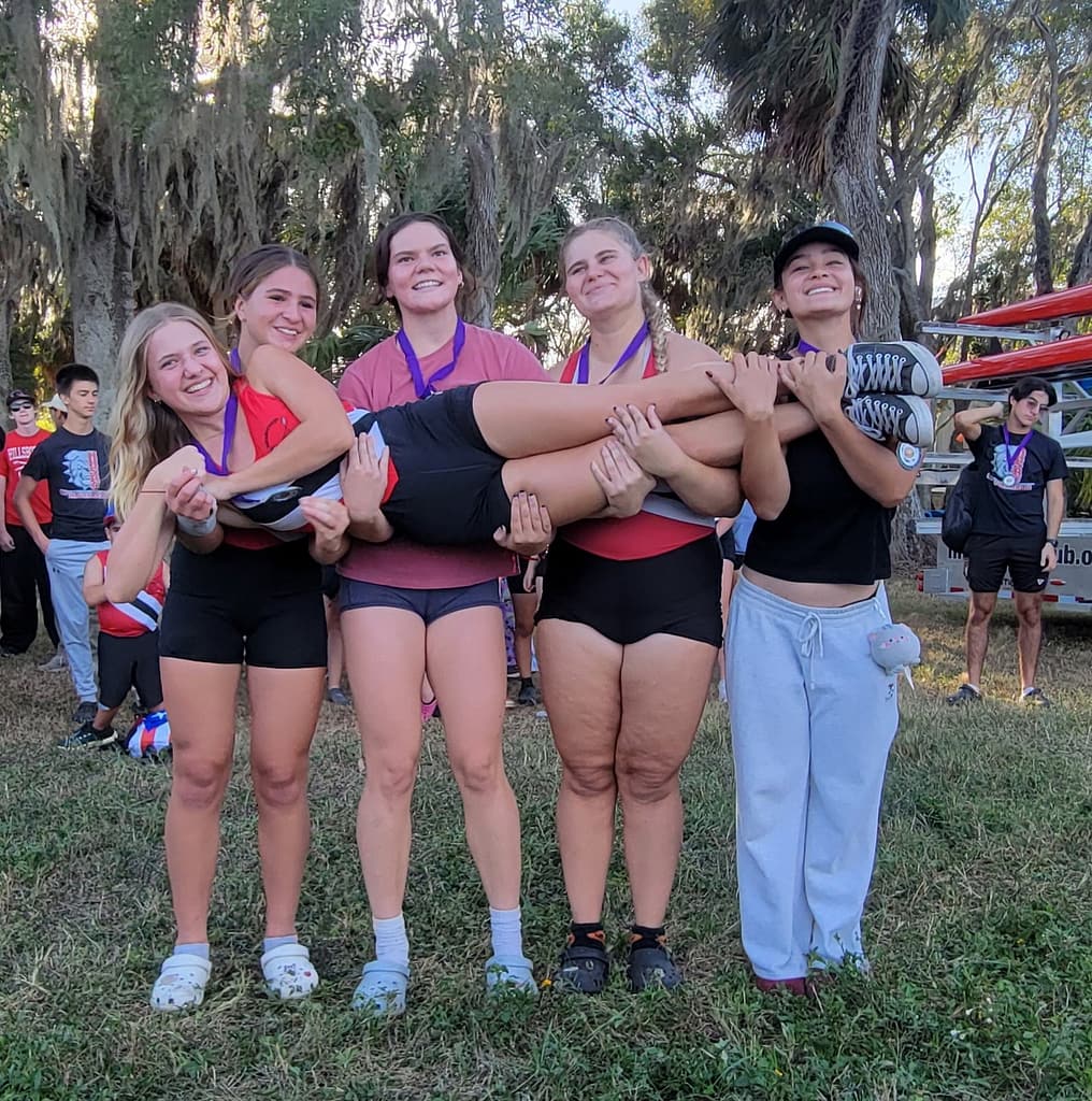 Girls Rowing Crew Holding Their Coxswain (Abby)
