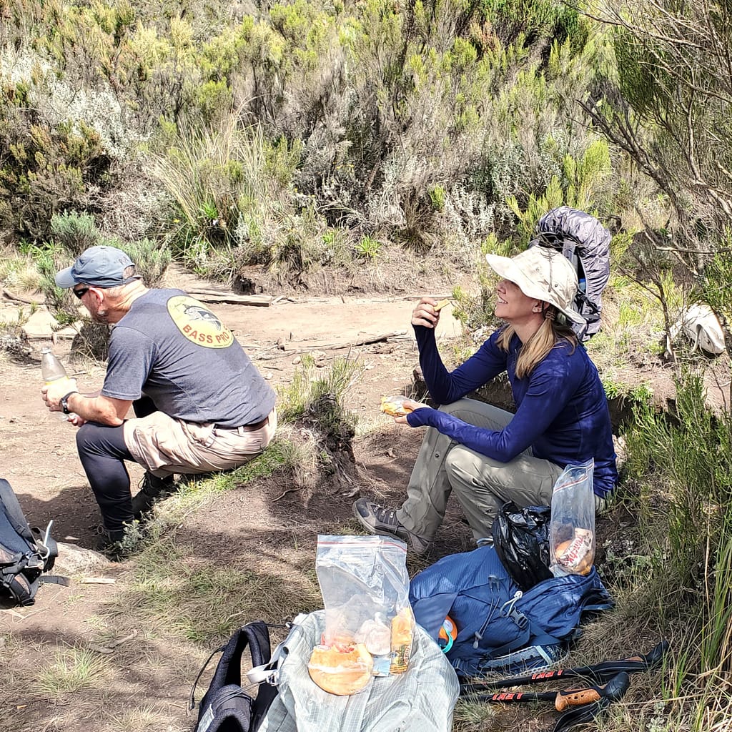 Kim Enjoying a Snack on Mt. Kilimanjaro