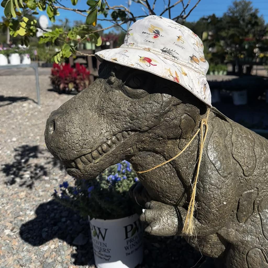 Dinosaur Statue Wearing Bucket Hat