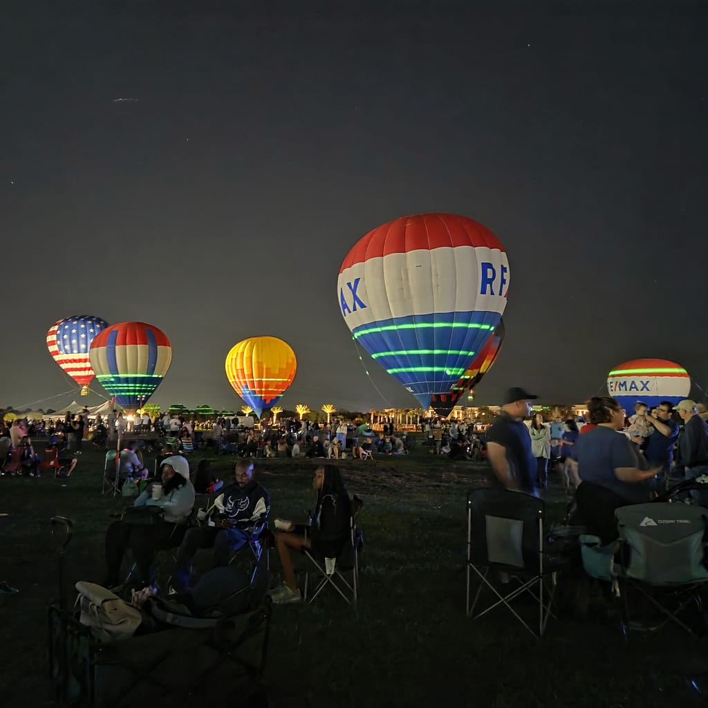Several Hot Air Balloons in the Night Sky