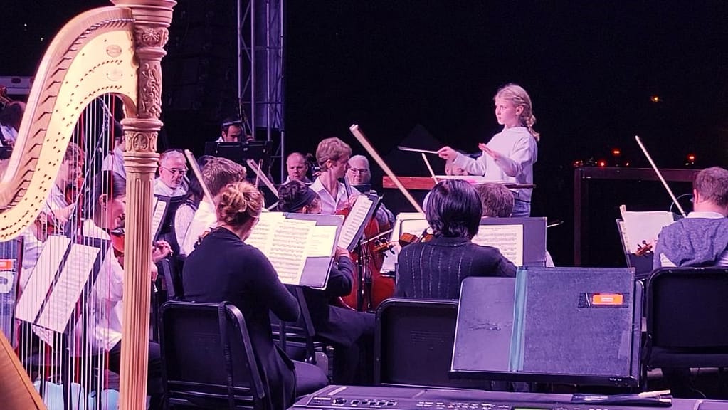 Maddy the Maestro, conducting the Florida Orchestra at Pops in the Park 2023.