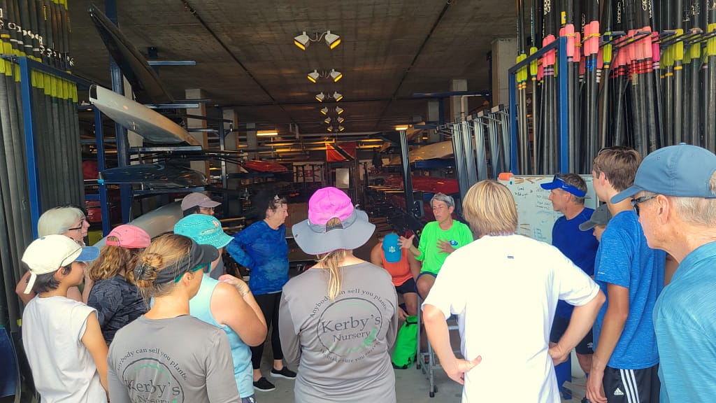 Kerby's Staff Listening to Rowing Coach