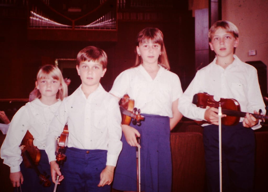 Joey and His Siblings with Their Violins