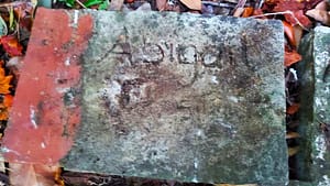 Stone with Abby's hand and footprints in 2011