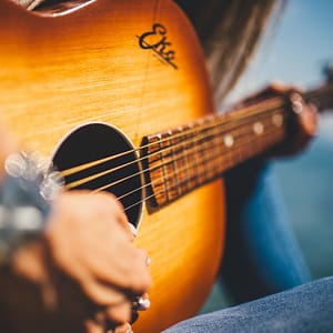 Hands Playing a Guitar