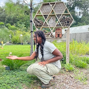 Girl Enjoying a Flower in Kerby's Homegrown National Park®