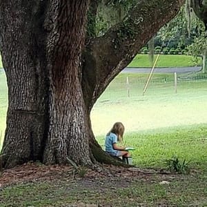 Maddy Writing Poetry Under a Tree