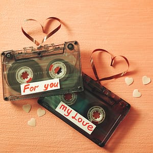 Two Cassette Tapes (Mixtapes) with the words "For You" and "My Love" on Them, Plus the Tape Pulled Out and Shaped Like a Heart on Each