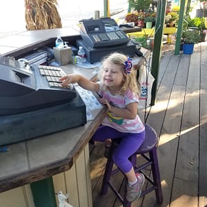 Maddy at the Cash Register at Kerby's Nursery