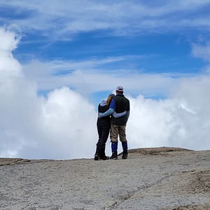 Couple Embracing at the Summit of Mt. Kilimanjaro
