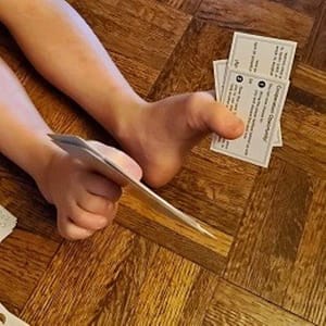 Feet Holding Cards