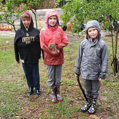 The Trio Playing in the Rain