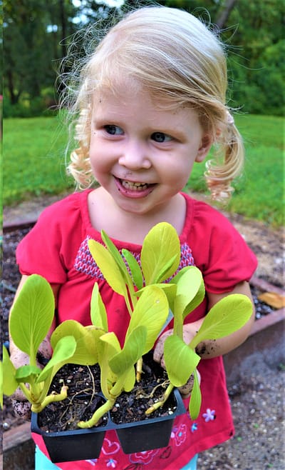 Maddy with Tomato Plants