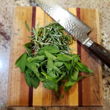 Herbs on a Cutting Board with a Knife