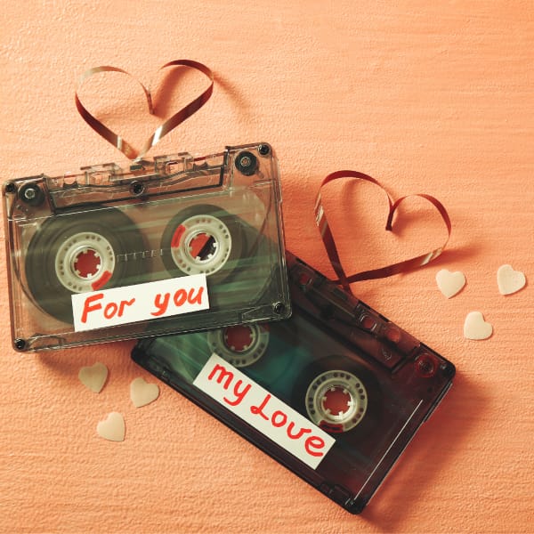 Two Cassette Tapes (Mixtapes) with the words "For You" and "My Love" on Them, Plus the Tape Pulled Out and Shaped Like a Heart on Each