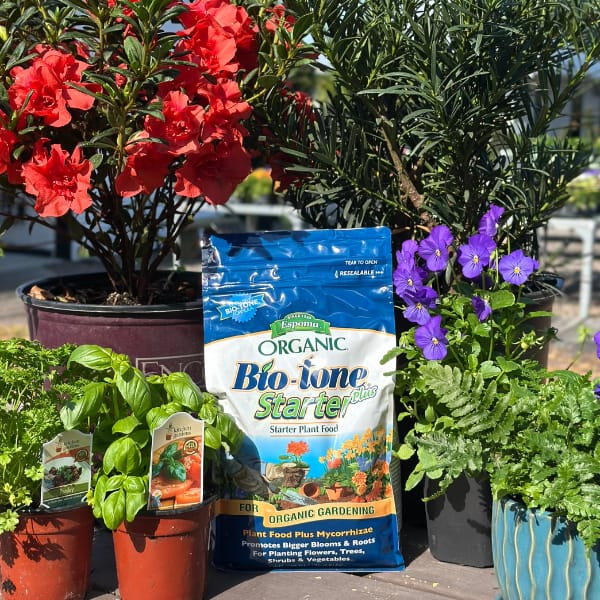 Picture of Bio-tone Starter Plus Plant Food Surrounded by Plants