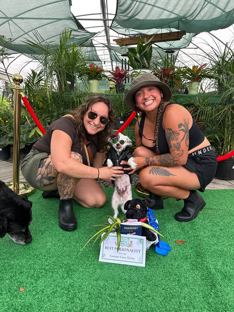 Two Ladies with Dog in Jacket and Sunglasses