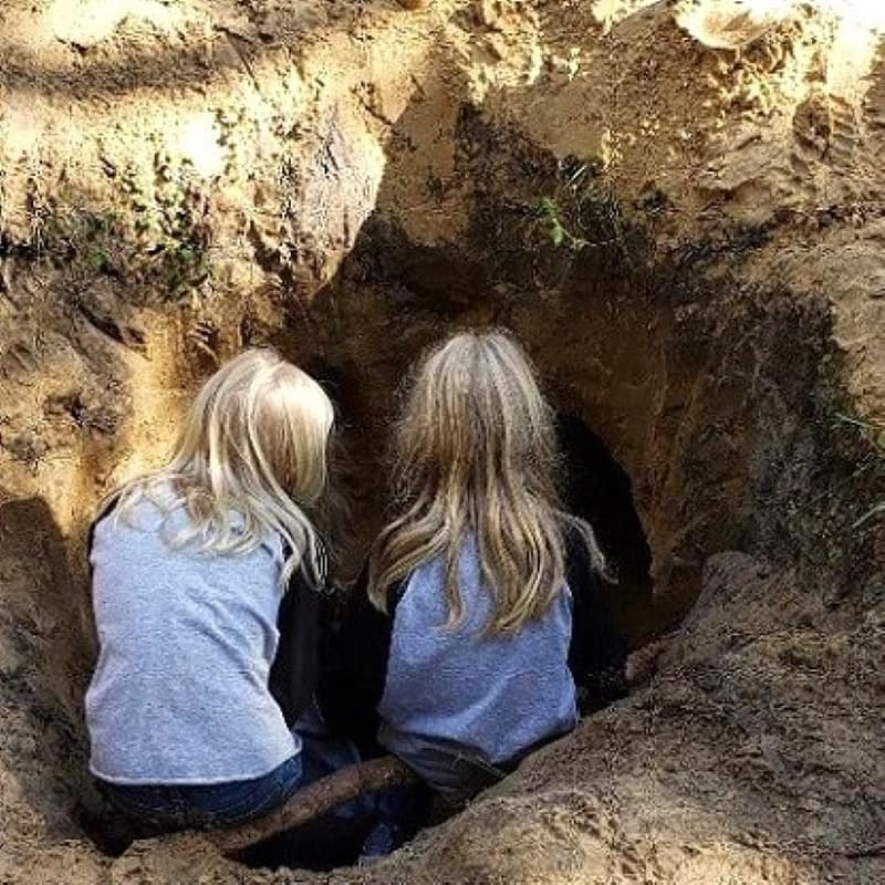 Two Girls Looking Down into Underground Clubhouse