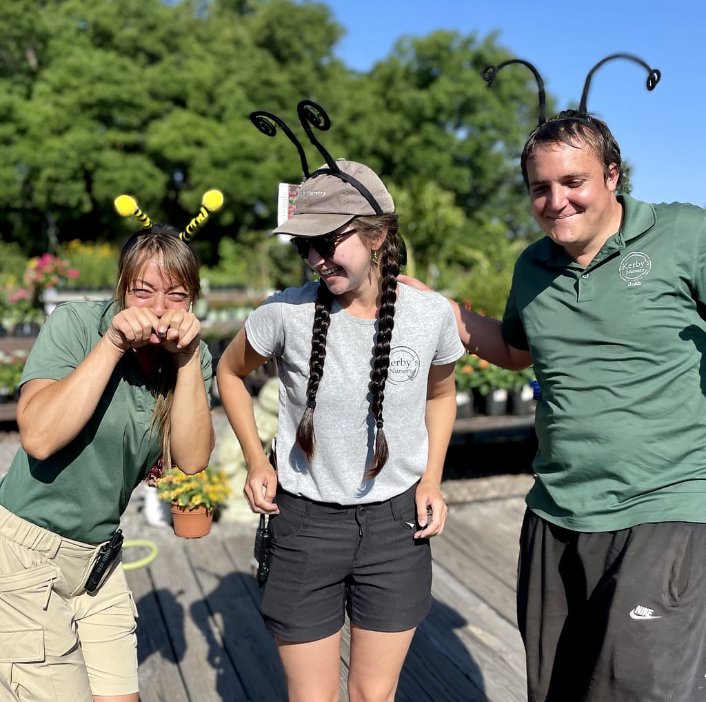Three Kerby's Nursery Staff Members with Pollinator Headbands for Earth Day