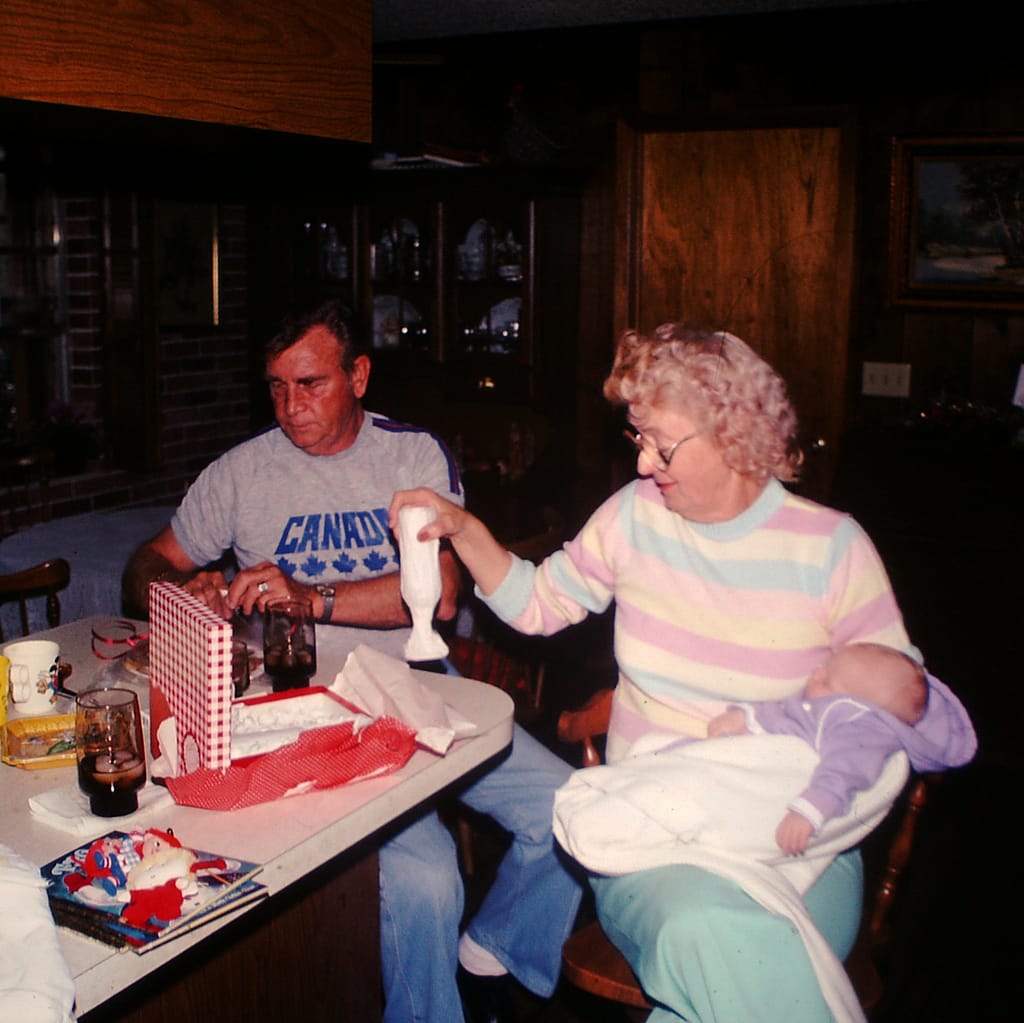 Grandma and Grandpa with Baby at Kitchen Table