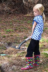 Abby with a Shovel in the Garden