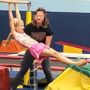 Abby Doing Gymnastics (Swinging on a Bar)