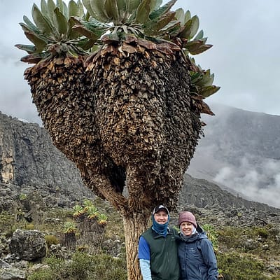 Kim and Joey with a Large Plant on the Mountain