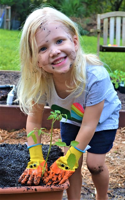 Abby Planting a Vegetable Plant