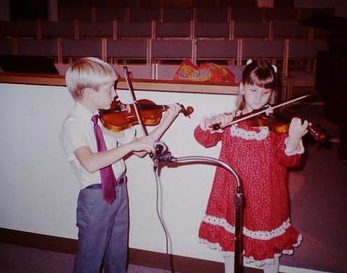 Joey and His Sister Playing Their Violins