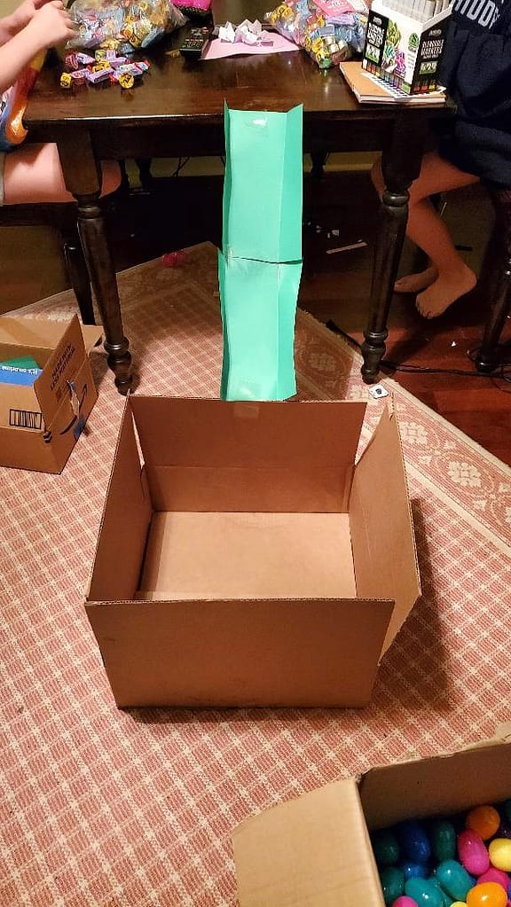 Homemade Slide to Move Stuffed Easter Eggs into a Box