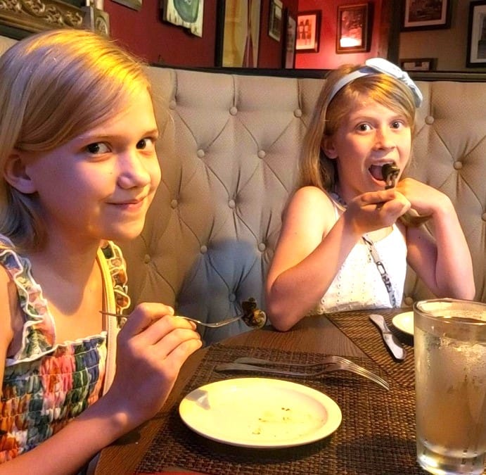 Abby and Maddy Eating Escargot