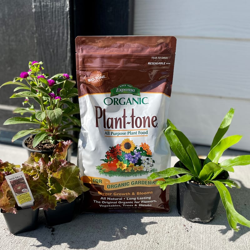 Bag of Espoma Organic® Plant-tone® Fertilizer with plants