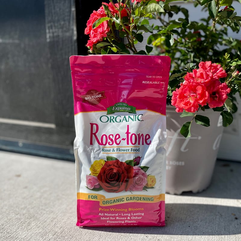 Bag of Espoma Organic® Rose-tone® Fertilizer with plants